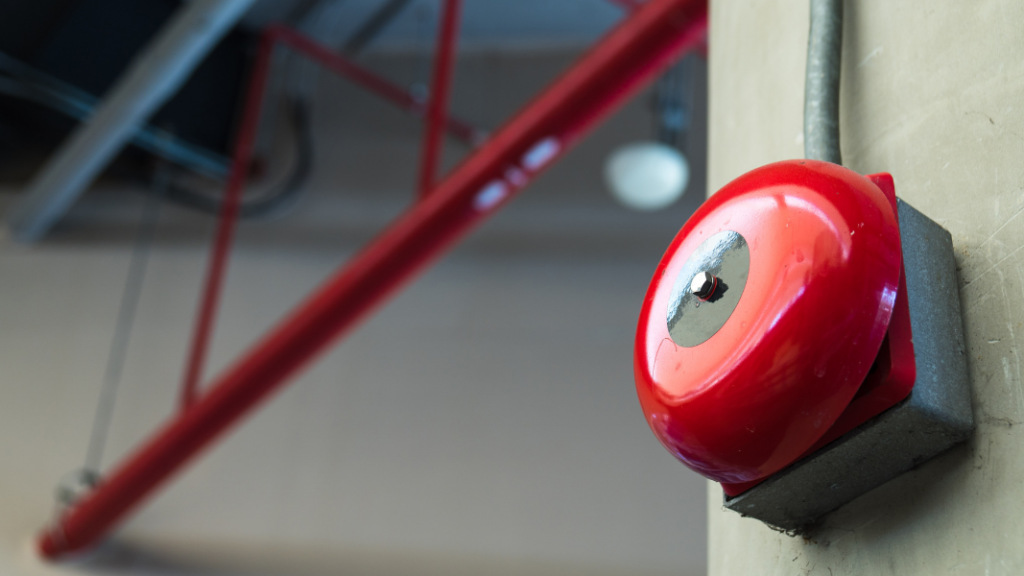 A red fire alarm bell.