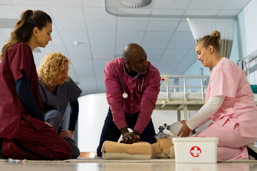 Instructor demonstrating CPR in first aid training