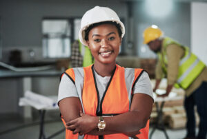 A woman smiling while she takes her course for safety officer.